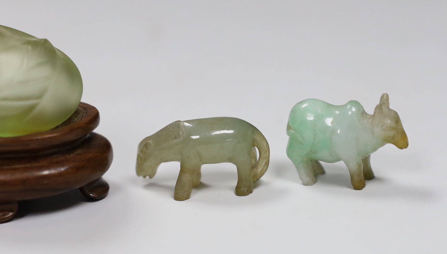 A Chinese jade snuff bottle, together with six animal hardstone figures, and a small perfume bottle